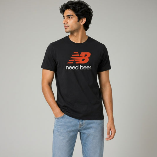 Shuflz black 100% premium cotton unisex t-shirt with orange and white "need beer" graphic.