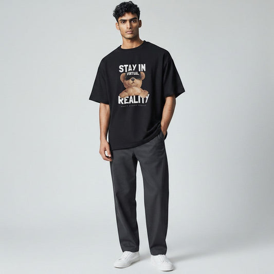 Shuflz black 100% cotton oversized t-shirt with "Stay In Virtual Reality" graphic featuring a teddy bear wearing VR goggles.